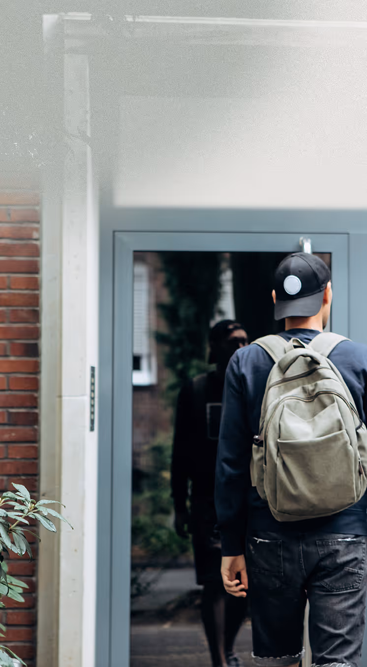 Student walking past an Alcatraz reader on campus